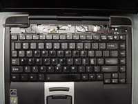 Remove screws securing keyboard